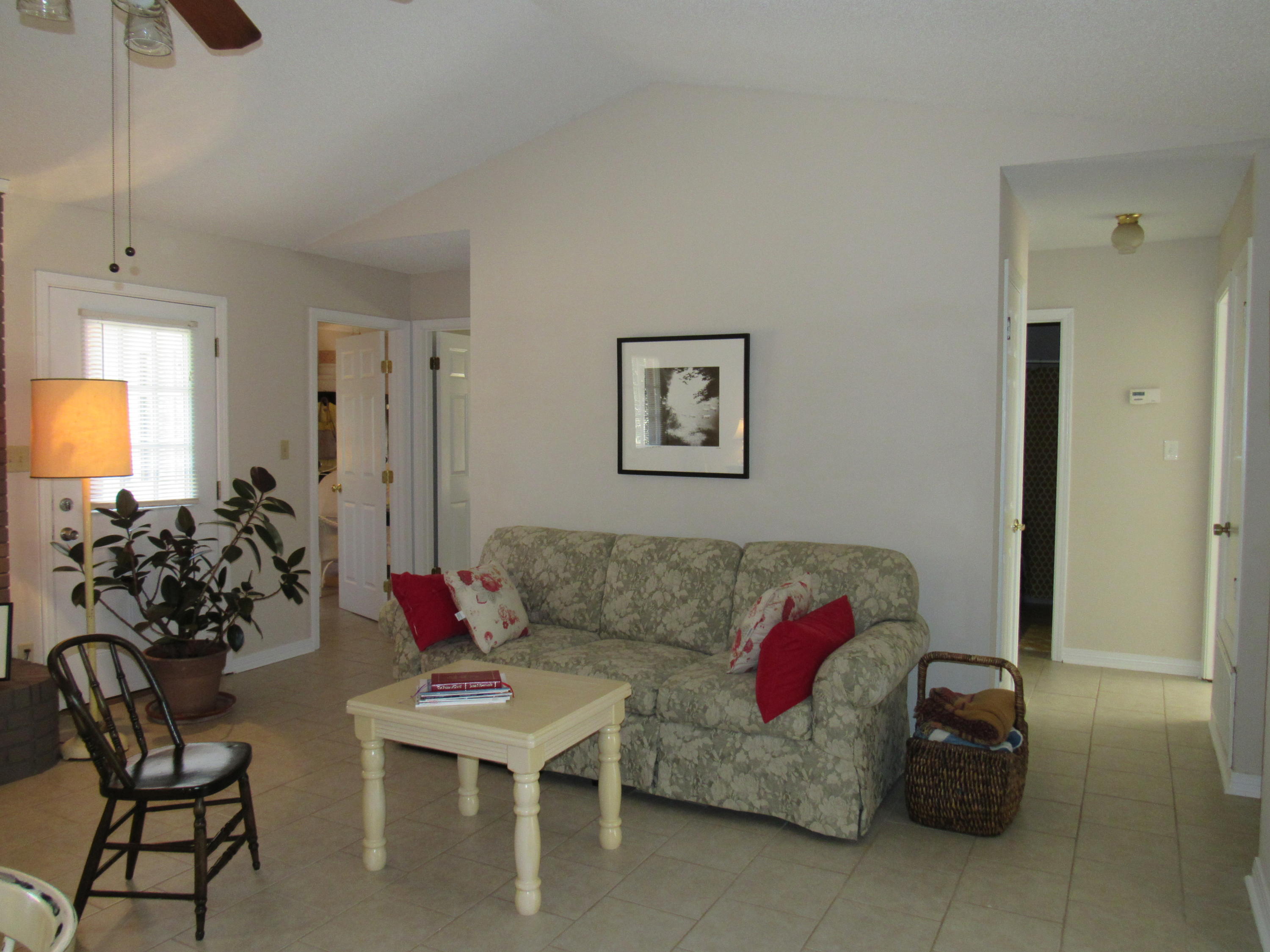 4736 Bob Sikes Road DeFuniak Springs, FL 32435 - Photo 3 of 16 a living room with furniture and a potted plant