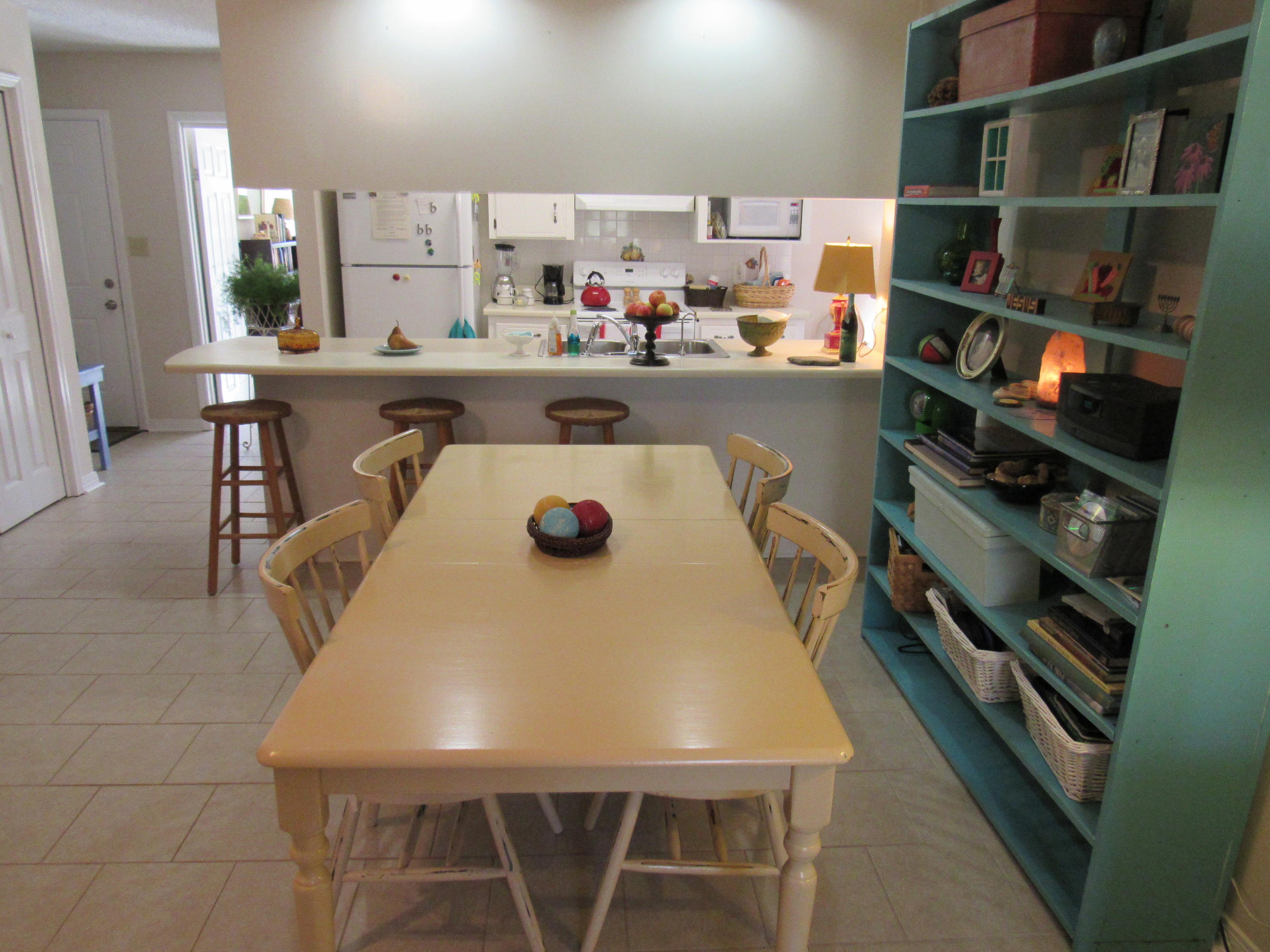4736 Bob Sikes Road DeFuniak Springs, FL 32435 - Photo 5 of 16 a dining room with a table and chairs
