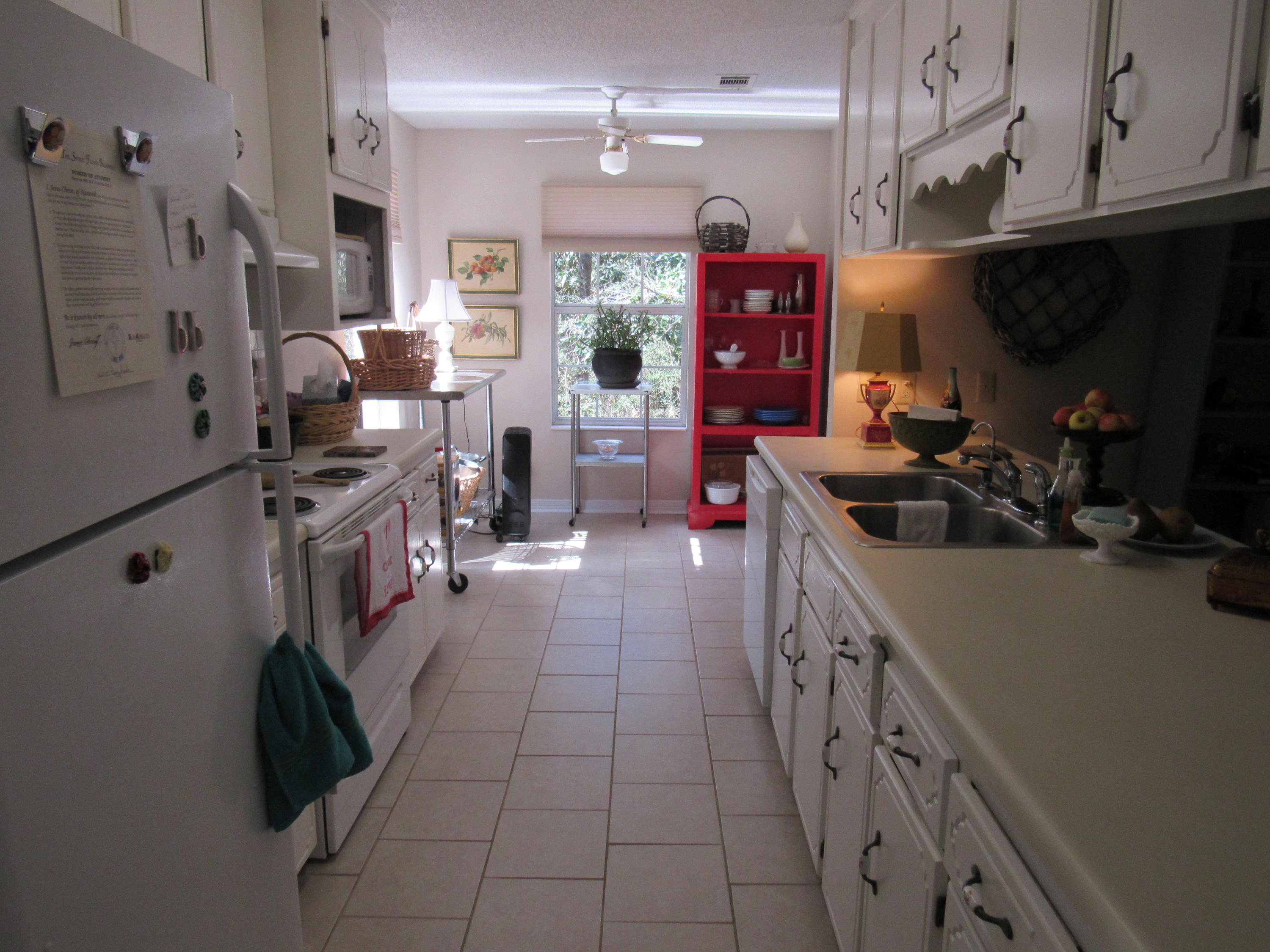 4736 Bob Sikes Road DeFuniak Springs, FL 32435 - Photo 6 of 16 a kitchen with stainless steel appliances granite countertop a stove and a sink