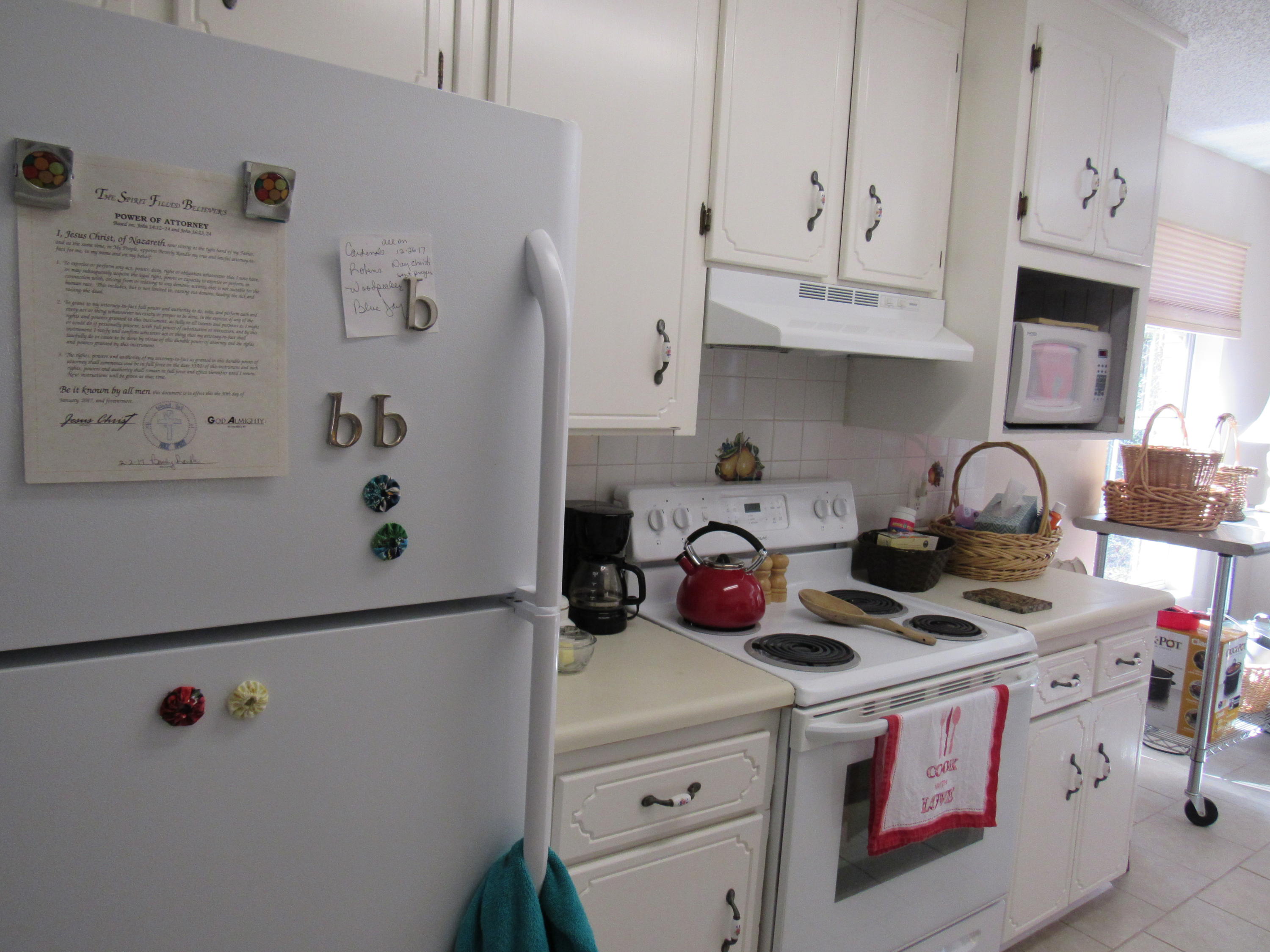 4736 Bob Sikes Road DeFuniak Springs, FL 32435 - Photo 7 of 16 a kitchen with stainless steel appliances a stove a refrigerator and a cabinets