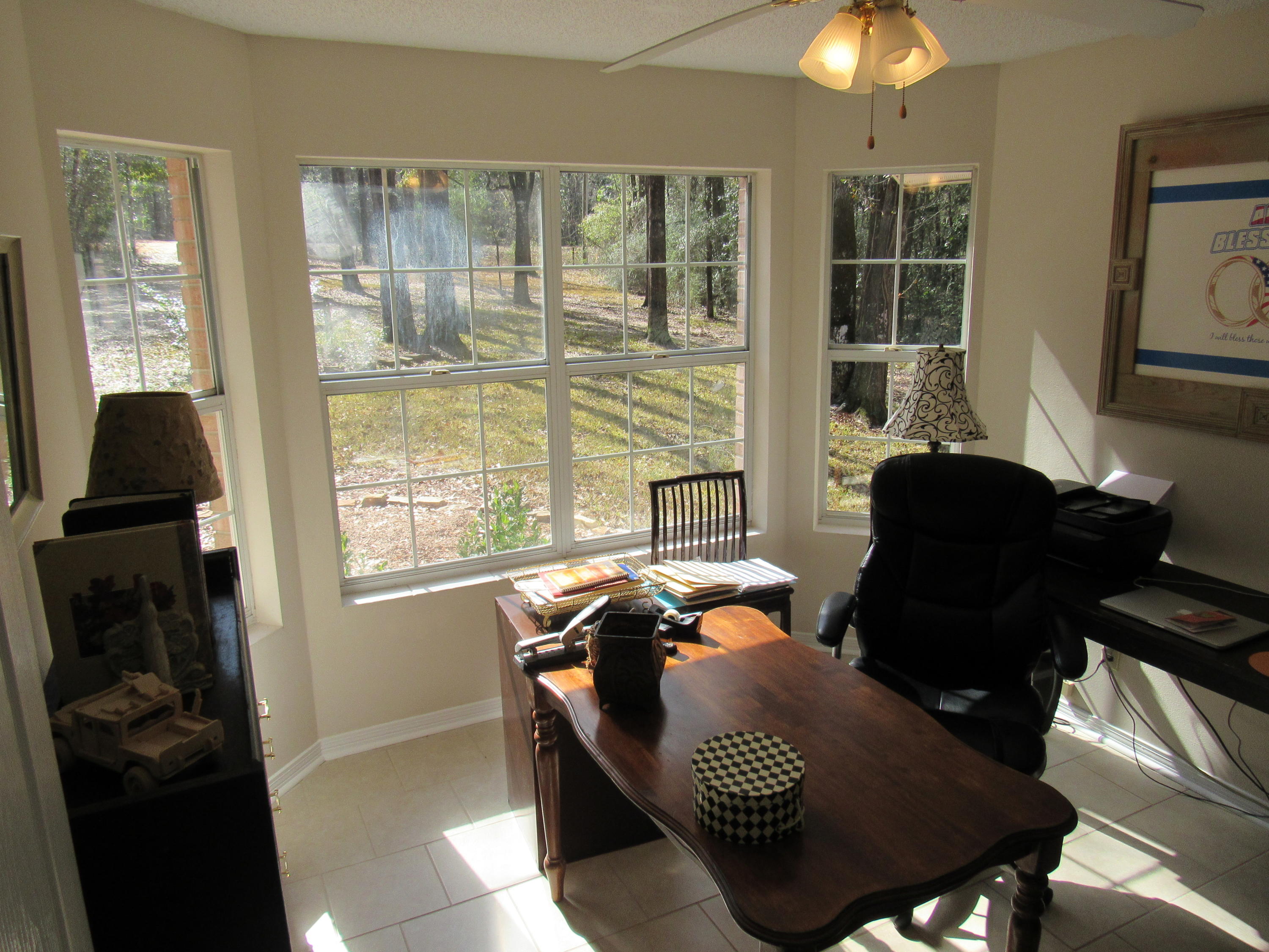 4736 Bob Sikes Road DeFuniak Springs, FL 32435 - Photo 9 of 16 a living room with furniture and a window