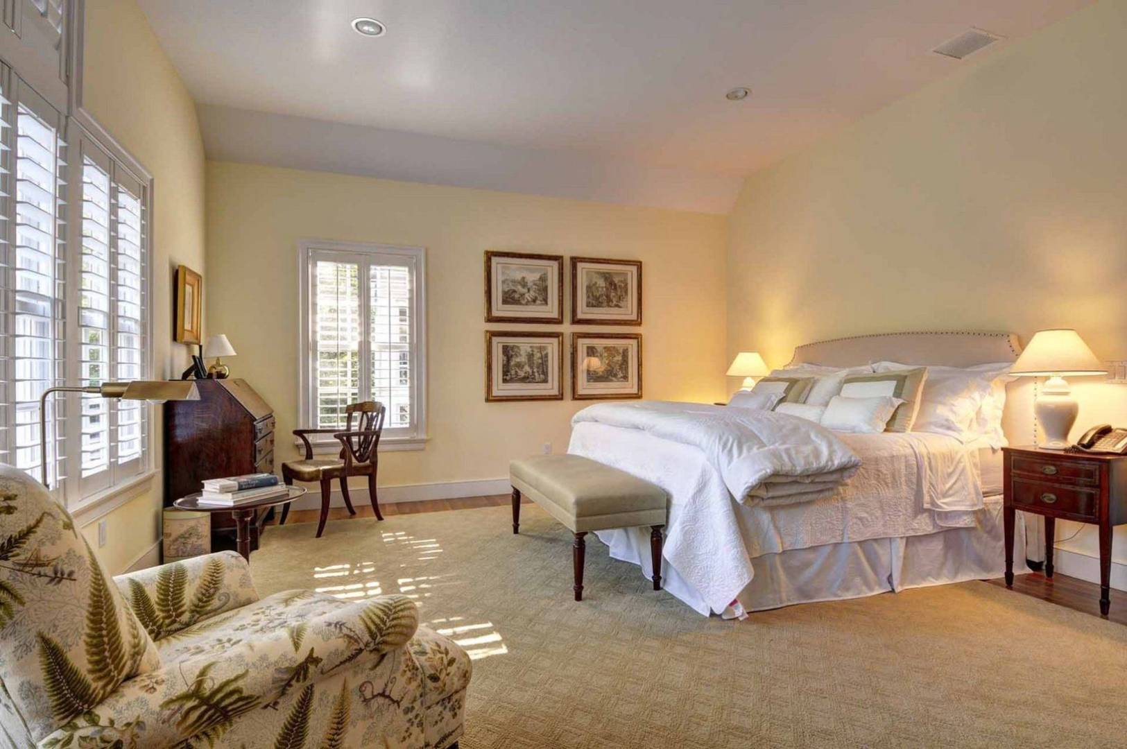 136 Merchants Path Wainscott, NY 11963 - Photo 13 of 17 a bedroom with a bed and a chandelier