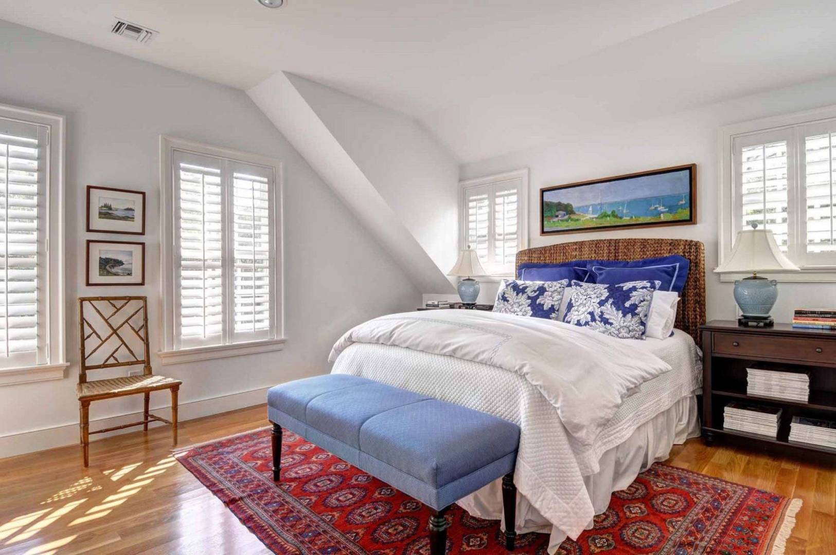 136 Merchants Path Wainscott, NY 11963 - Photo 9 of 17 a bedroom with a bed and a window