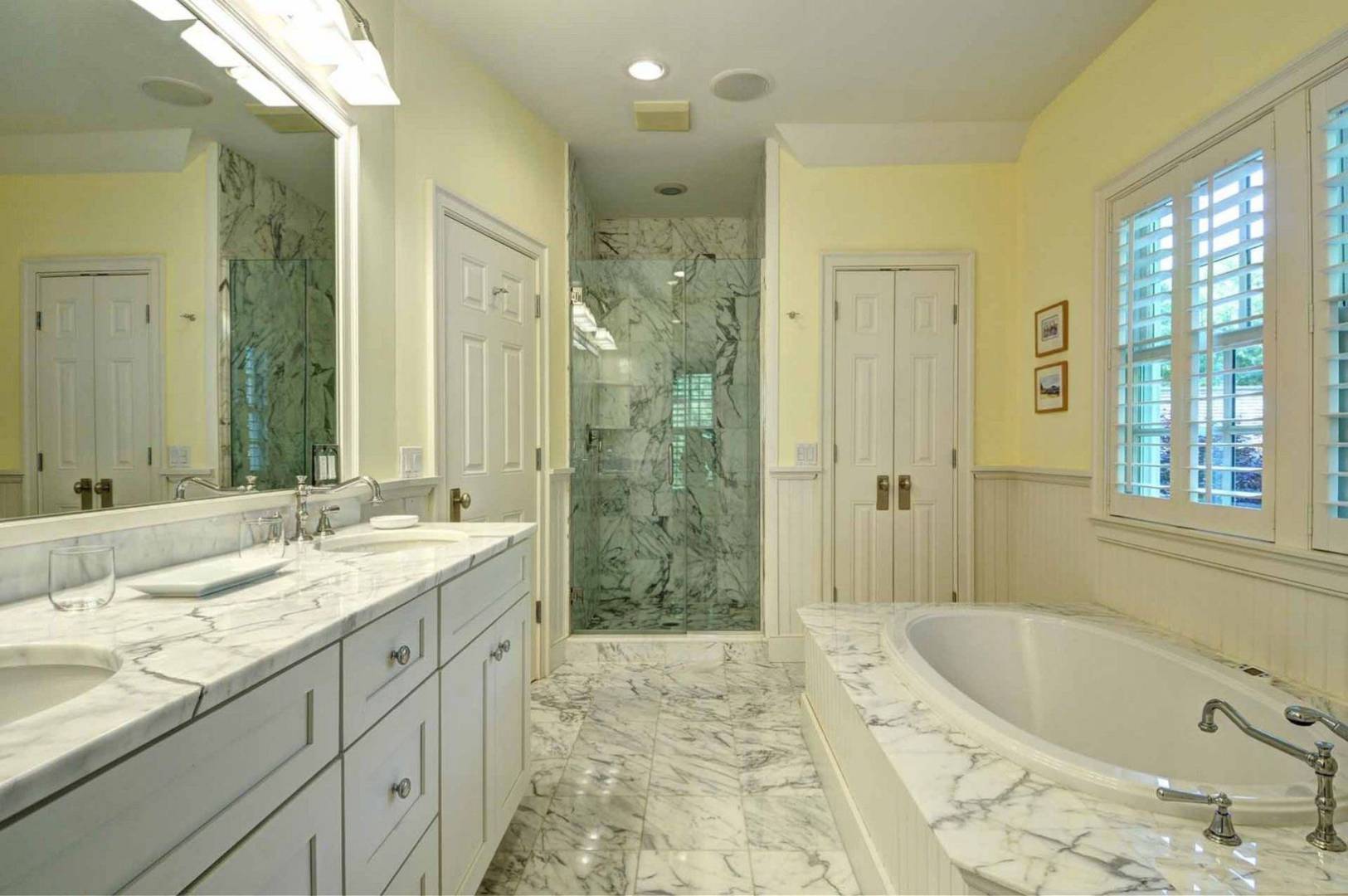 136 Merchants Path Wainscott, NY 11963 - Photo 10 of 17 a bathroom with a granite countertop tub sink and shower