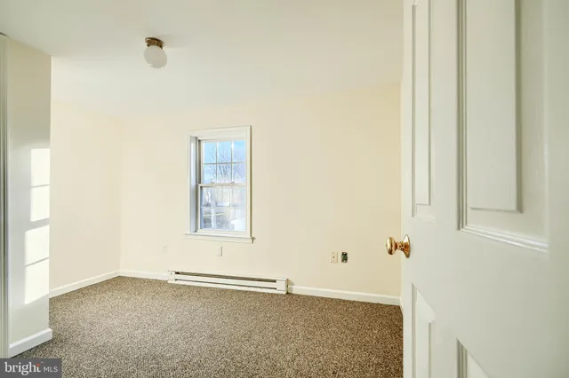 a view of an empty room with window