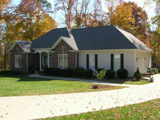 237 Fork Junction Road Timberlake, NC 27583 - Photo 1 of 1 a front view of a house with a yard and garage