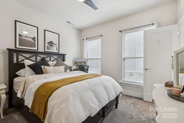 a bedroom with a bed and a couch