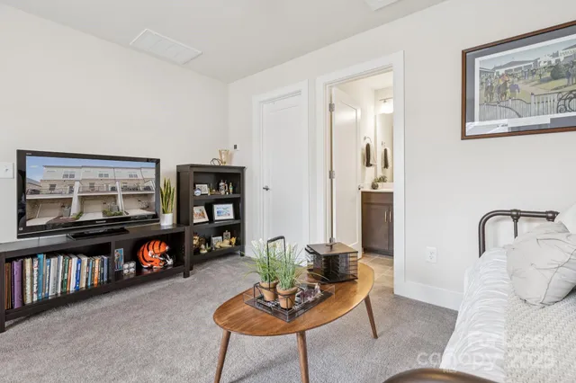 a bedroom with furniture and a chandelier