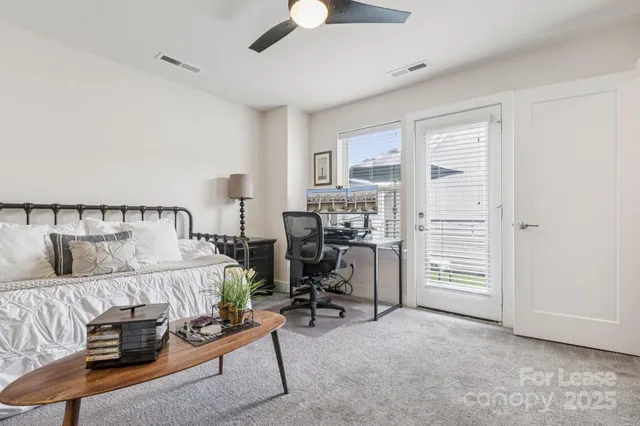 a bathroom with a sink mirror vanity and toilet