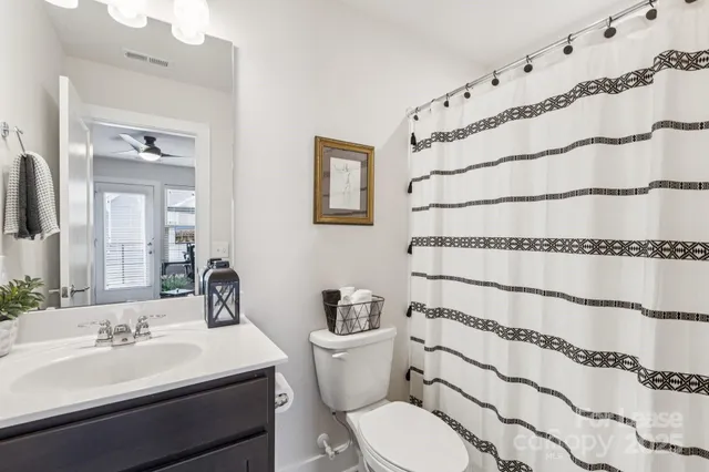 a view of backyard with a chair and table