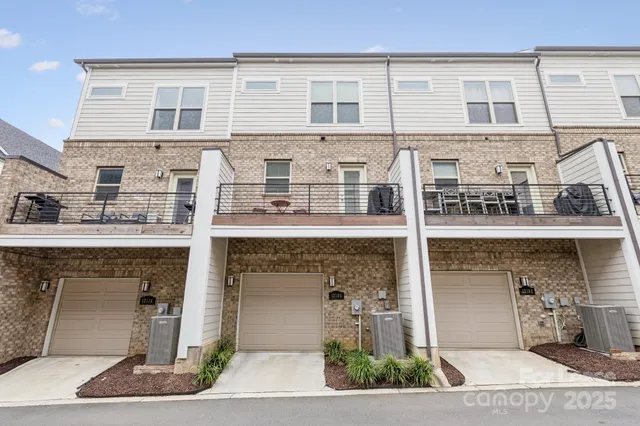 a couple of potted plants in front of door