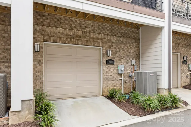 a view of a balcony with chairs and wooden floor