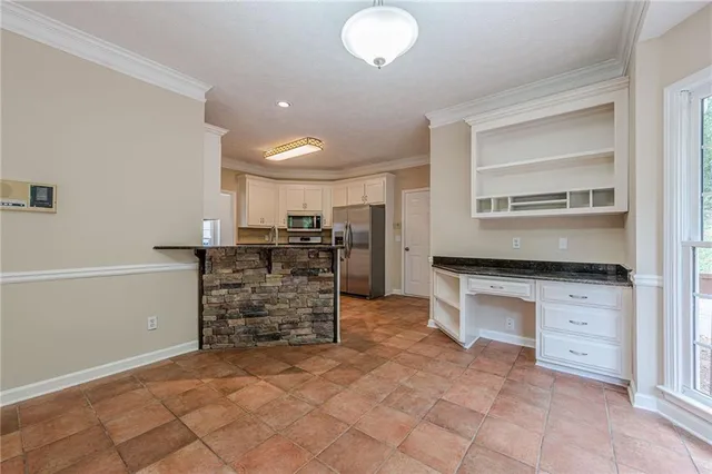 a view of room with furniture and a ceiling fan