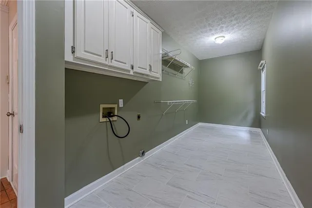 a bathroom with a granite countertop sink a toilet and a mirror