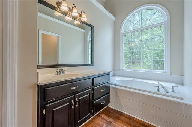 a kitchen with stainless steel appliances granite countertop a stove sink and cabinets