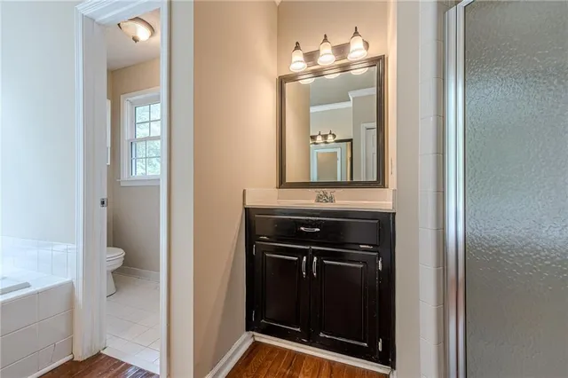 a kitchen with granite countertop a stove and a refrigerator