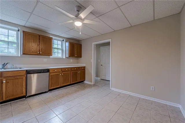 a view of a house with backyard and porch