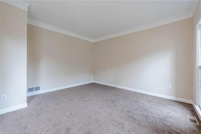 a view of an empty room with stairs