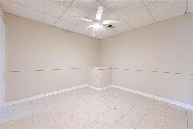 an aerial view of a house with a yard and garden
