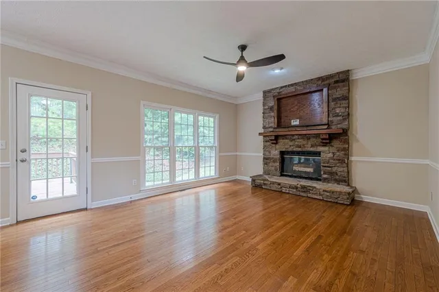 a living room with furniture fireplace and flat screen tv