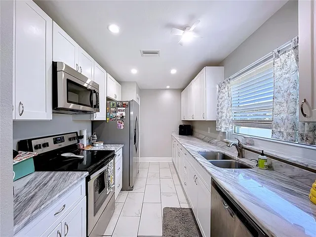 a kitchen with a sink and counter space