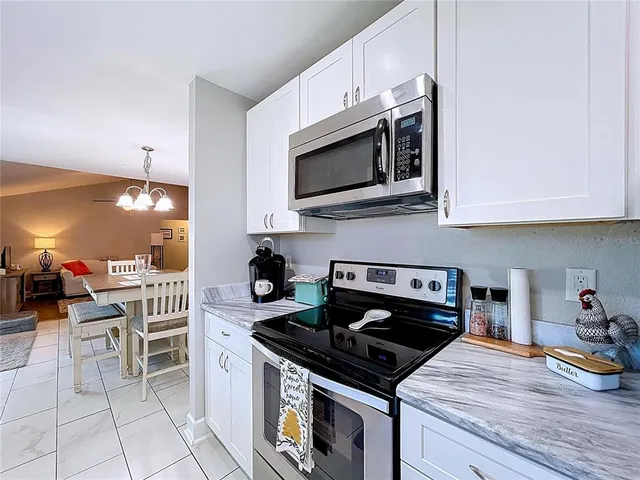 a view of a hallway with entryway wooden floor and front door