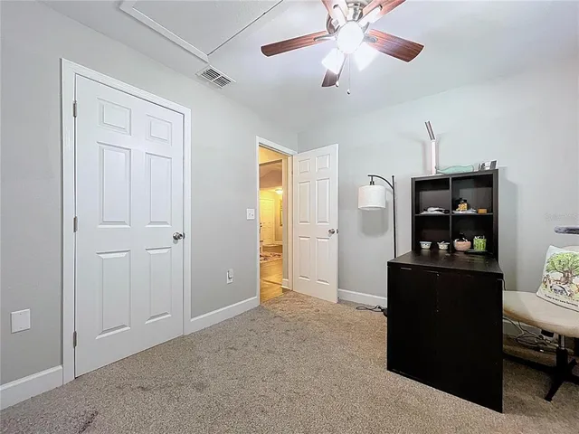 a spacious bathroom with a sink and a mirror