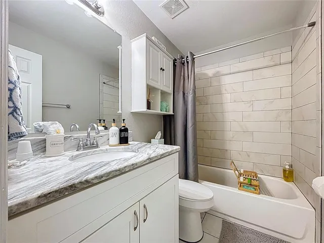 a kitchen with a sink and a mirror