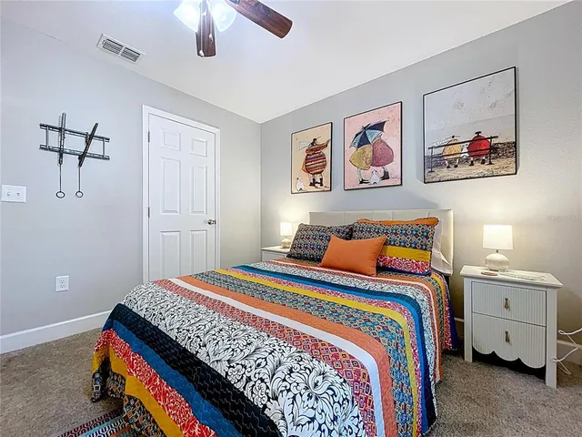 a bedroom with bed and a window