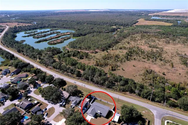 an aerial view of a house with outdoor space