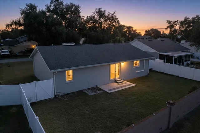 a view of a house with a yard