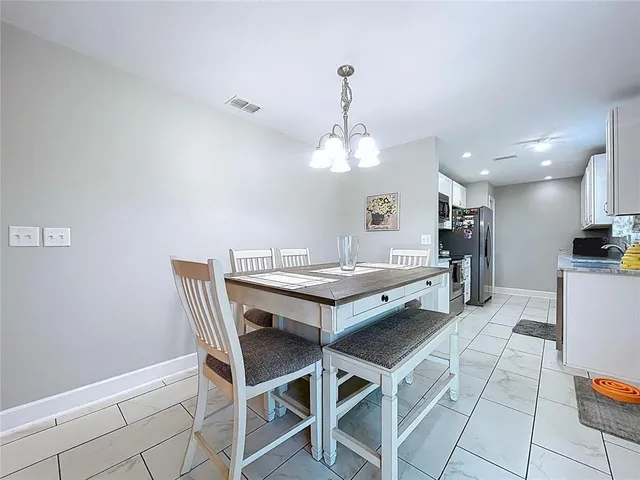 a view of a dining room with furniture