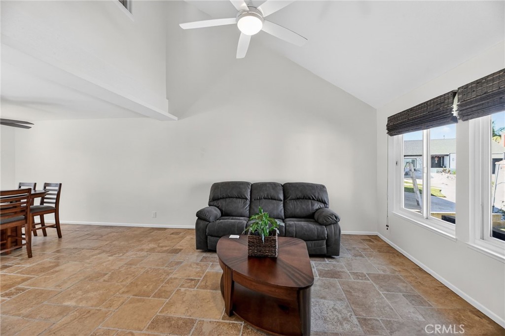 6116 East Paseo Rio Azul Anaheim, CA 92807 - Photo 13 of 54 a living room with furniture and a window