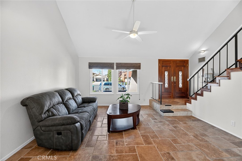 6116 East Paseo Rio Azul Anaheim, CA 92807 - Photo 15 of 54 a living room with furniture and a chandelier