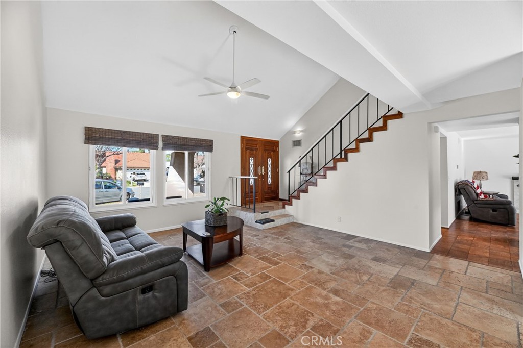 6116 East Paseo Rio Azul Anaheim, CA 92807 - Photo 16 of 54 a living room with furniture and a chandelier