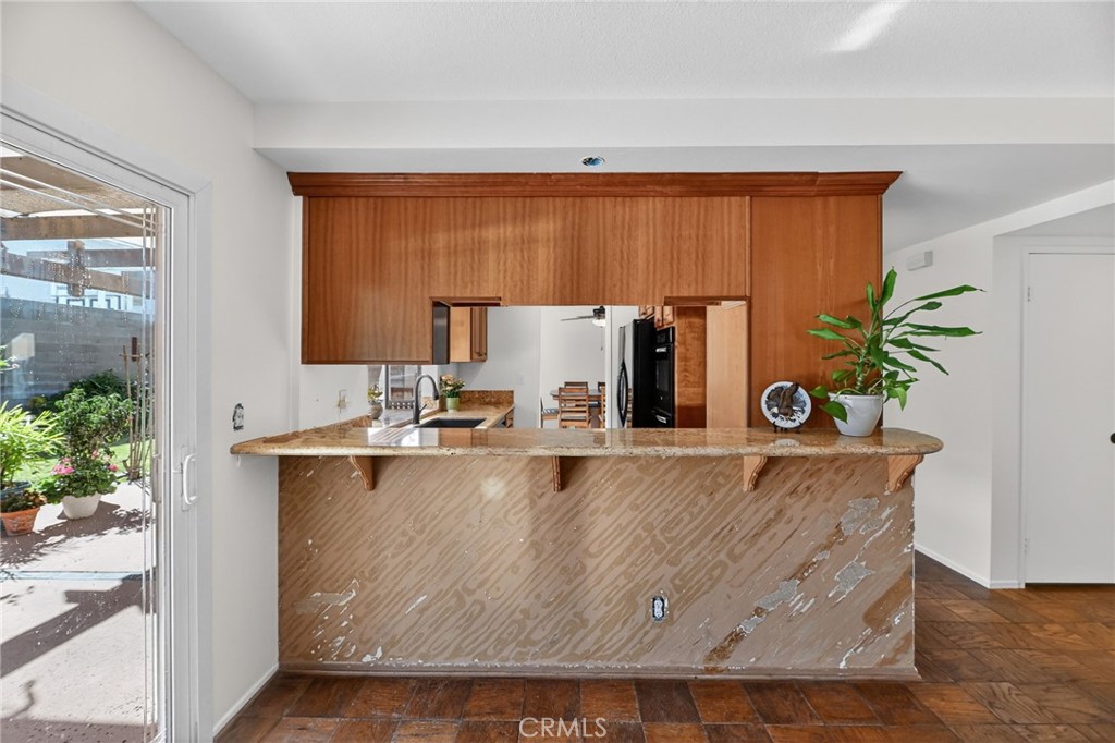 6116 East Paseo Rio Azul Anaheim, CA 92807 - Photo 23 of 54 a view of kitchen with stainless steel appliances granite countertop a sink a stove and a refrigerator