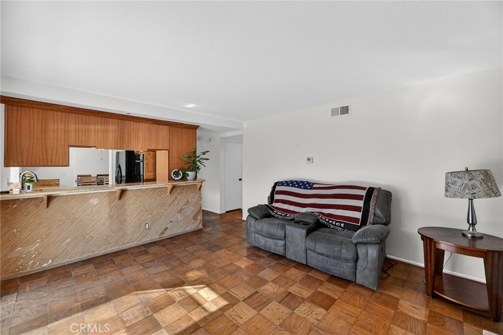 6116 East Paseo Rio Azul Anaheim, CA 92807 - Photo 25 of 54 a living room with furniture and a piano