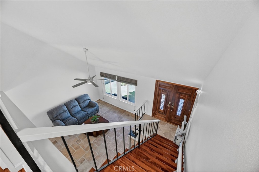 6116 East Paseo Rio Azul Anaheim, CA 92807 - Photo 27 of 54 a living room with furniture and a wooden floor