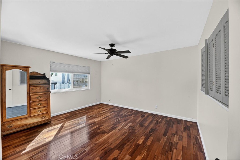 6116 East Paseo Rio Azul Anaheim, CA 92807 - Photo 30 of 54 a view of a livingroom with wooden floor and a ceiling fan