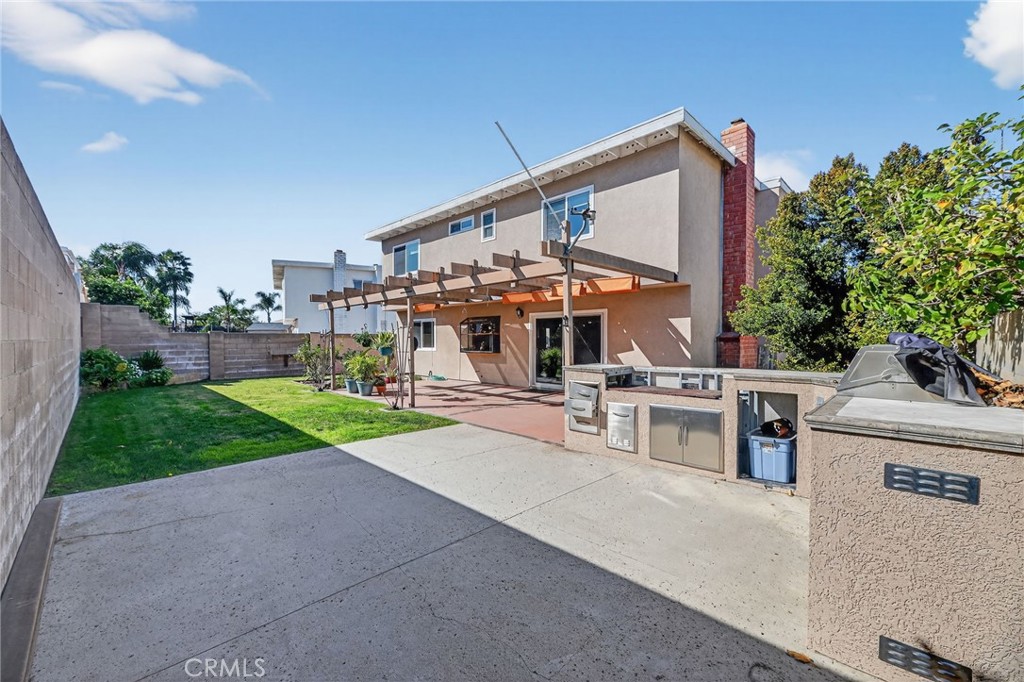 6116 East Paseo Rio Azul Anaheim, CA 92807 - Photo 42 of 54 a view of a house with a yard and sitting area