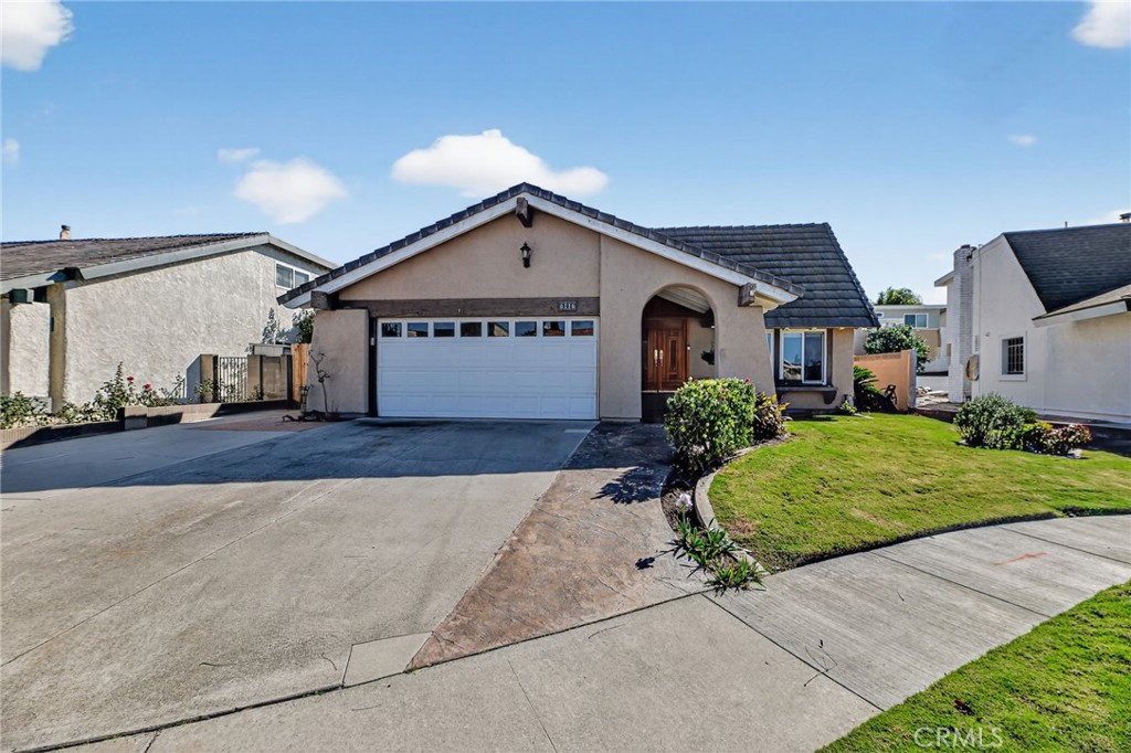 6116 East Paseo Rio Azul Anaheim, CA 92807 - Photo 54 of 54 a front view of a house with a yard