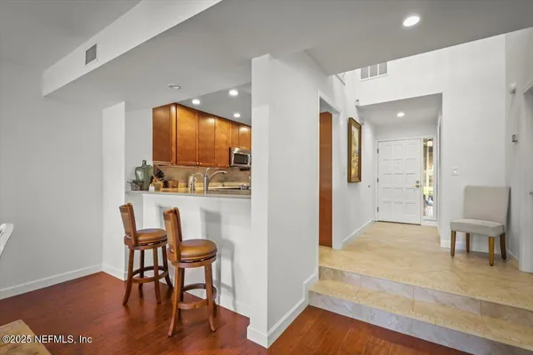 a view of a livingroom with furniture and a mirror