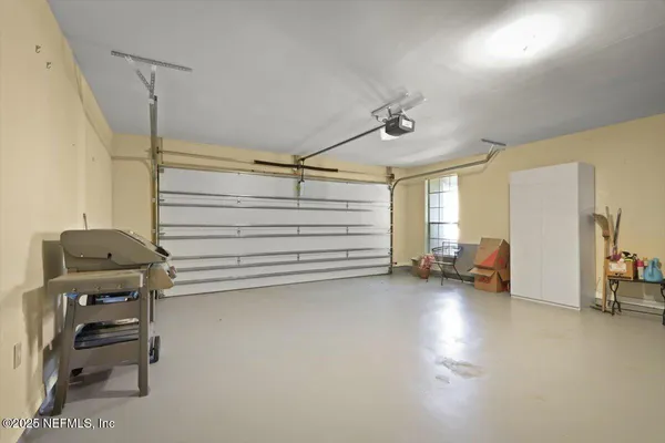 a view of a livingroom with furniture and staircase
