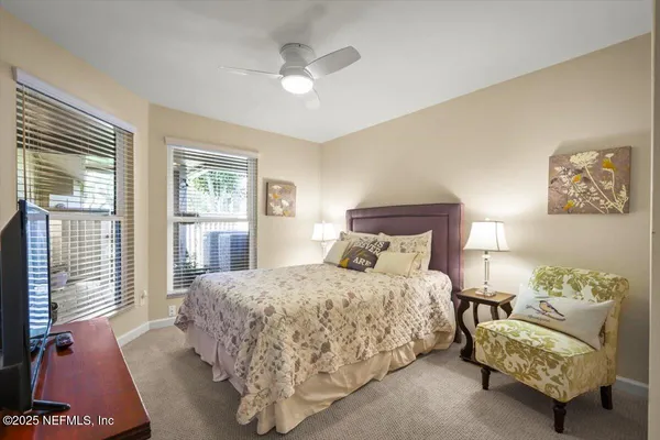 a bedroom with a bed and a couch