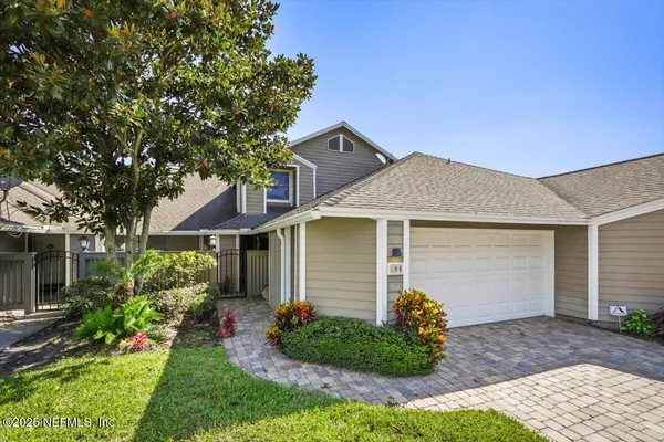a front view of a house with garden