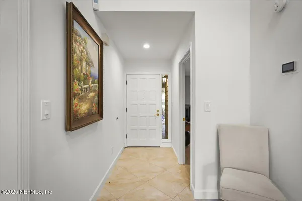a view of an entryway with wooden floor