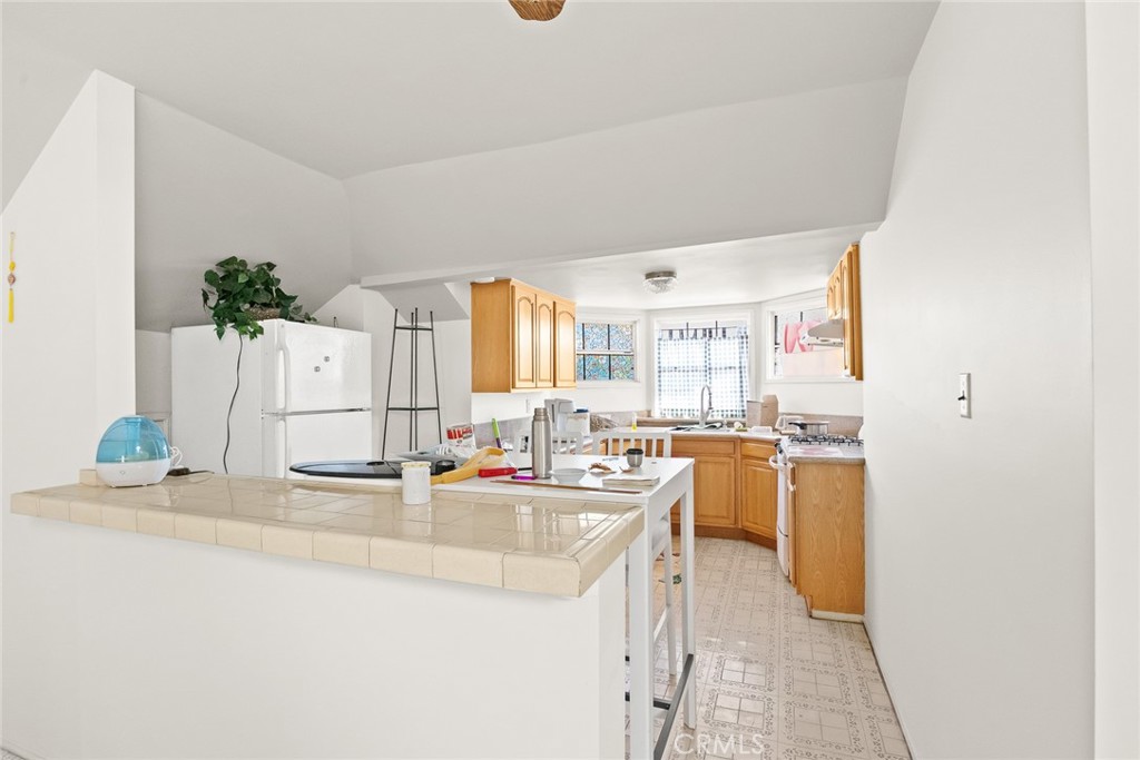 2003 Vine Street Alhambra, CA 91801 - Photo 32 of 43 a kitchen with sink refrigerator and stove