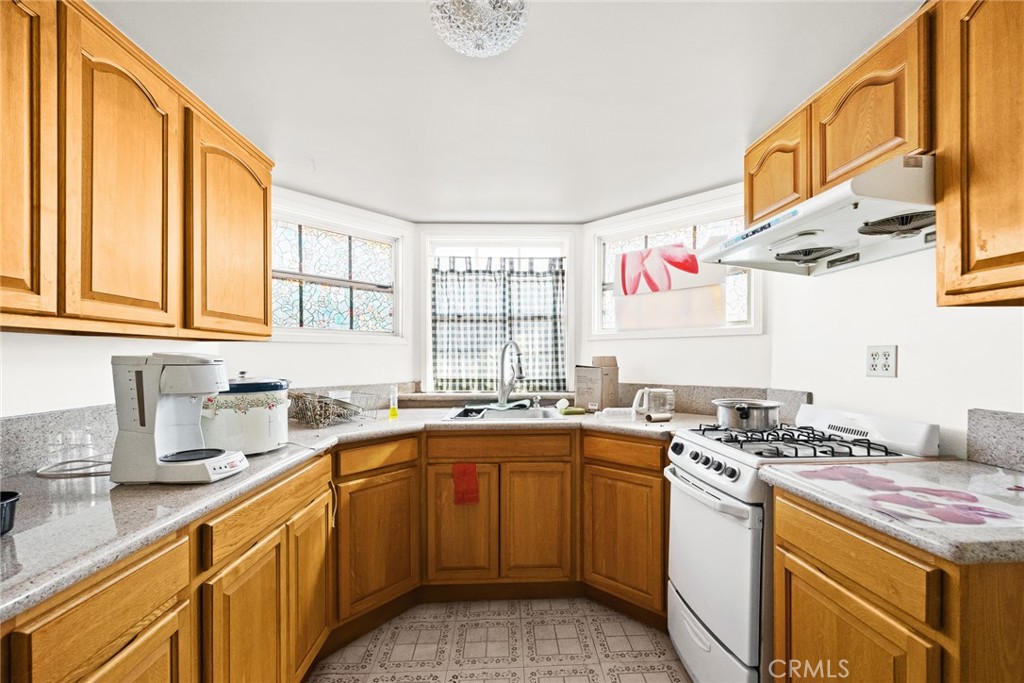 2003 Vine Street Alhambra, CA 91801 - Photo 33 of 43 a kitchen with a sink stove and cabinets