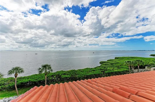 a living room with furniture ceiling fan and a rug