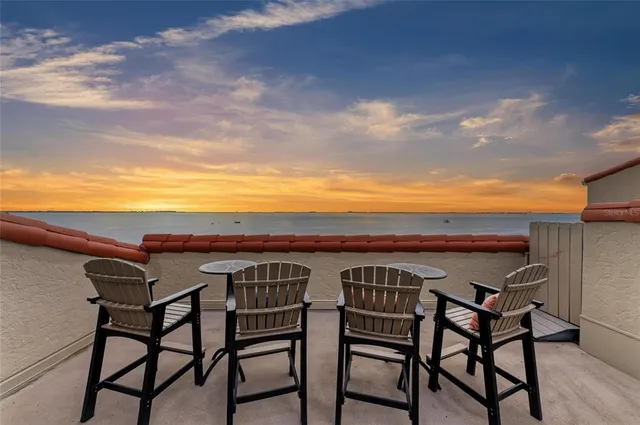 a view of a chairs and table on the terrace